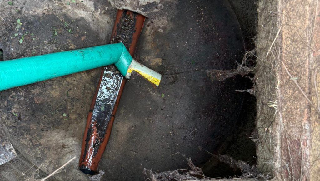 Drainage engineers in Twickenham carrying out a CIPP drain lining repair from a manhole, with a rat stopper installed to prevent rodent entry.